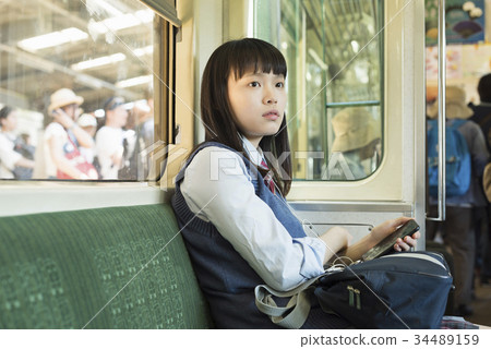 High school girl attending school train 34489159