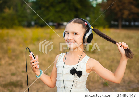 little girl with long hair listening song 34490448