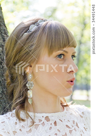 Beautiful talking bride with diadem in summer Beautiful talking bride with diadem in summer 34491448