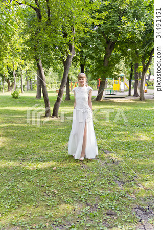 Beautiful bride in white lace dress of summer time 34491451