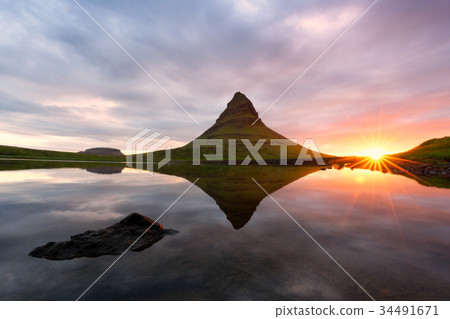 Colorful sunrise on Kirkjufellsfoss waterfall 34491671