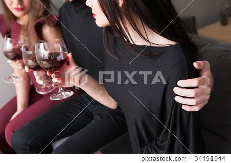 Male flirting with female on party with drinks 34491944