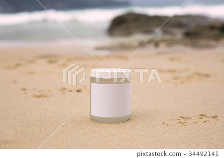 Bottle of sunblock on a sea background Bottle of sunblock on a sea background 34492141
