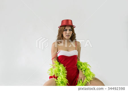 Beautiful happy woman in sexy Santa Claus clothes. 34492398