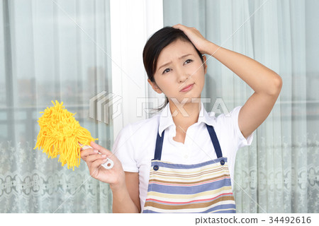 有疲乏的表示的主婦 有疲乏的表示的主婦 34492616