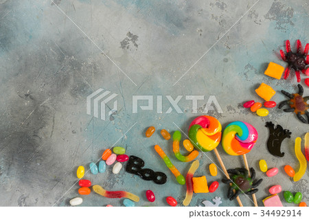 Colorful halloween candies on stone 34492914