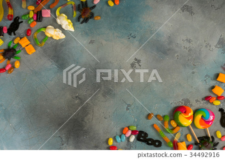 Colorful halloween candies on stone Colorful halloween candies on stone 34492916