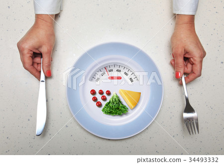 healthy food and hands with kitchen flatware 34493332