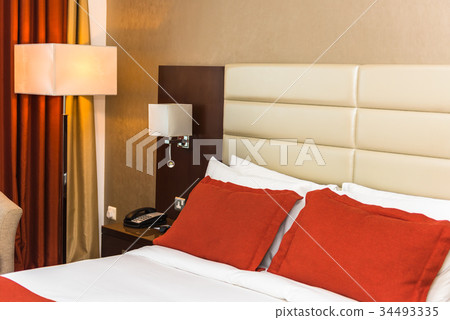 Hotel room with a prepared fresh bed 34493335