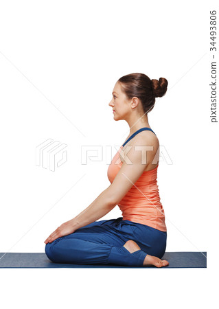 Woman in Hatha yoga asana Vajrasana Woman in Hatha yoga asana Vajrasana 34493806