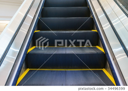 Escalator in Community Mall, Shopping Center. 34496399