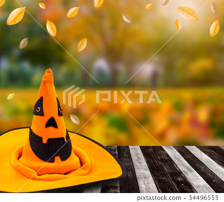 Halloween pumpkin face with autumn background 34496555