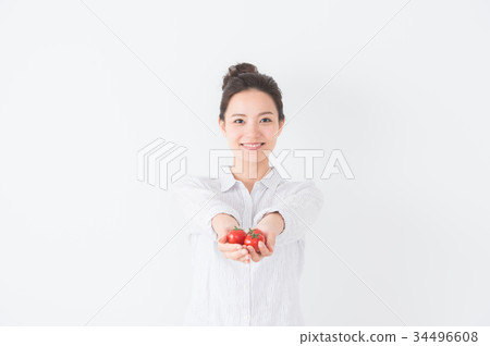 A woman with tomato 34496608