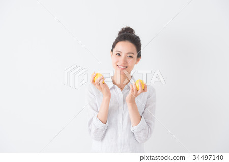 A woman with lemon A woman with lemon 34497140