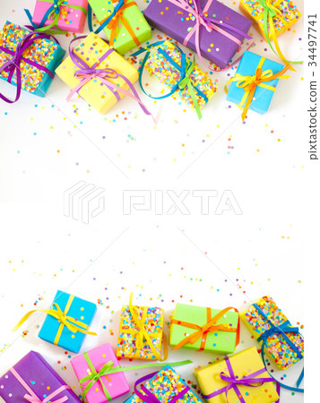 Colored gift boxes with colorful ribbons.  34497741