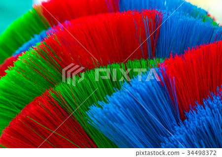 The colorful and patterns of plastic brooms. The colorful and patterns of plastic brooms. 34498372