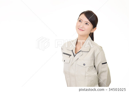 A smiling female worker A smiling female worker 34501025