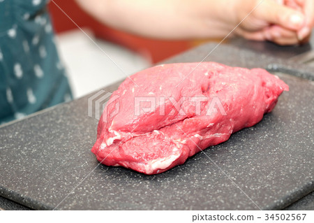 Large piece of red meat ready to cut Large piece of red meat ready to cut 34502567