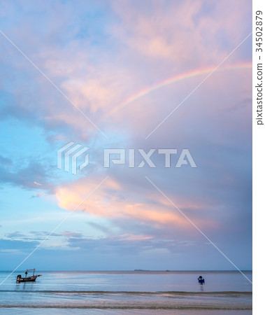 Rainbow and cloudy blue sky Rainbow and cloudy blue sky 34502879