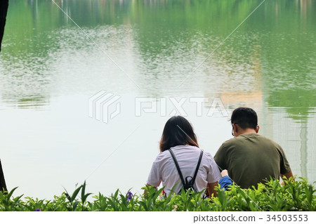 A couple from Hoan Kiem Lake in Hanoi, Vietnam A couple from Hoan Kiem Lake in Hanoi, Vietnam 34503553