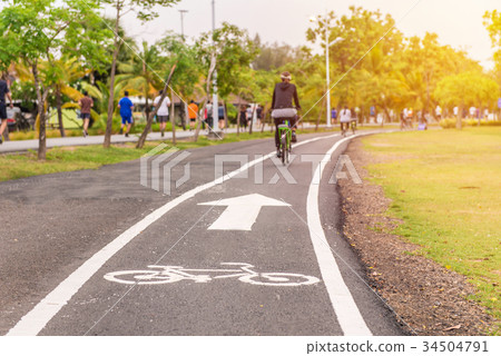 exercise with bicycle in public park outdoor sport exercise with bicycle in public park outdoor sport 34504791