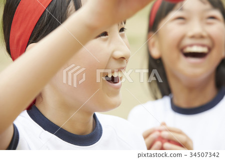 Primary schoolchild who participates in athletic meet 34507342
