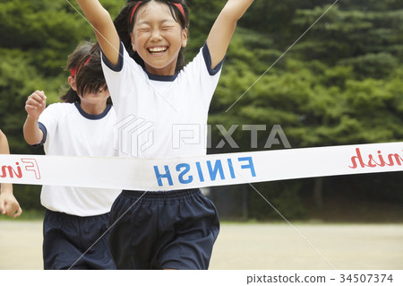 Elementary school student running at athletic meet Elementary school student running at athletic meet 34507374