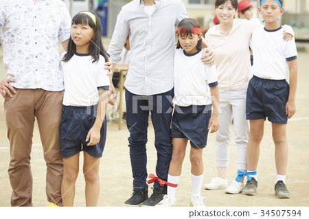 Sports day parent and two people tripod 34507594