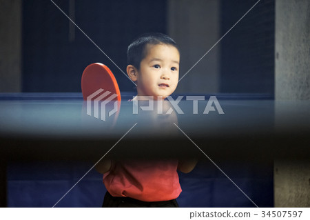 Boy playing table tennis 34507597