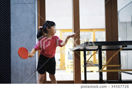 Girl playing table tennis 34507726