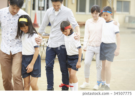 Sports day parent and two people tripod 34507775