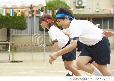 Elementary school student running at athletic meet 34507800