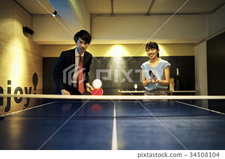 Couple playing table tennis Couple playing table tennis 34508104