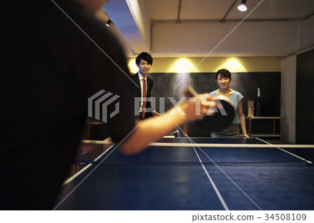 Couple playing table tennis 34508109