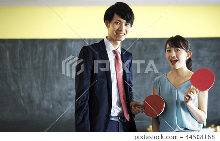 Couple playing table tennis 34508168