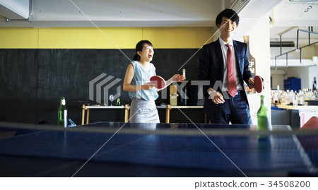 Couple playing table tennis 34508200
