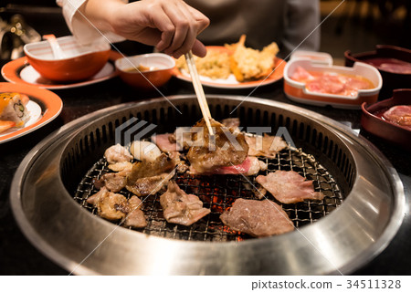 Raw beef and pork slice on grille for barbecue Raw beef and pork slice on grille for barbecue 34511328