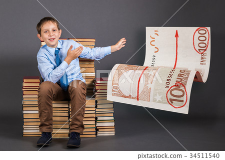 Education concept. Young businessman tells and demonstrates how Education concept. Young businessman tells and demonstrates how 34511540