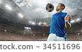 Soccer player performs an action play  34511696