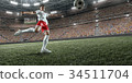 Soccer player performs an action play  34511704