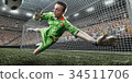 Soccer goalkeeper catches a ball 34511706