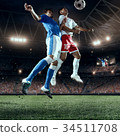 Soccer players performs an action play 34511708