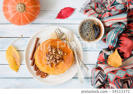 Pumpkin pancakes with pecan nuts and honey 34513372
