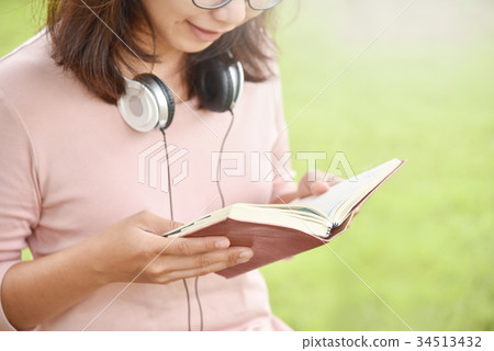 Happy Beautiful Asian woman reading book. Happy Beautiful Asian woman reading book. 34513432