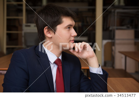 Portrait of a young successful man in a suit. 34513477