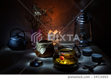 Pouring fresh tea to elegant china teacups. Pouring fresh tea to elegant china teacups. 34514893