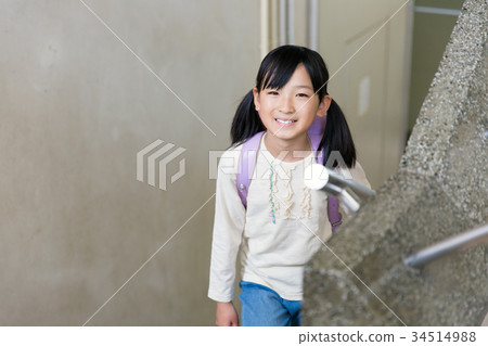 Primary school student attending school stairs Primary school student attending school stairs 34514988