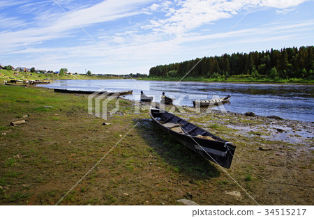 Moored to the shore near the village Moored to the shore near the village 34515217