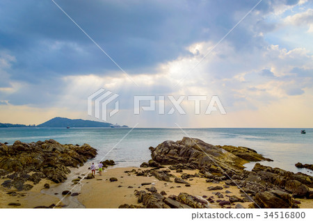 Rocky beach at sunset. Beautiful gold sundown Rocky beach at sunset. Beautiful gold sundown 34516800