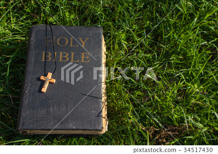 Vintage old holy bible book with christian cross 34517430